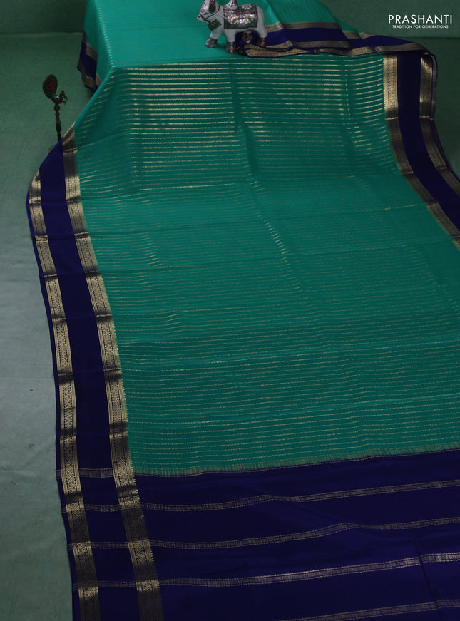 Pure mysore silk sareee teal green and blue with allover zari weaves and rettapet zari woven border