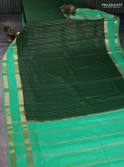 Pure mysore silk sareee bottle green and teal green with allover zari weaves and rettapet zari woven border