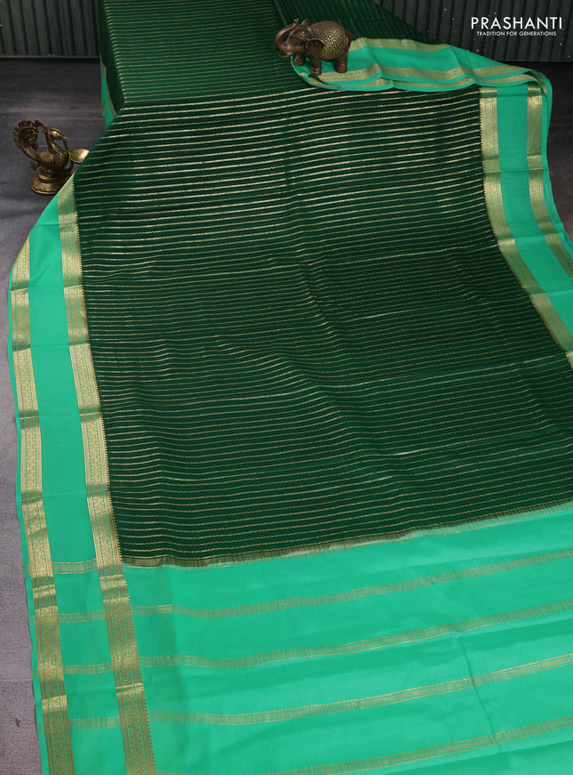 Pure mysore silk sareee bottle green and teal green with allover zari weaves and rettapet zari woven border
