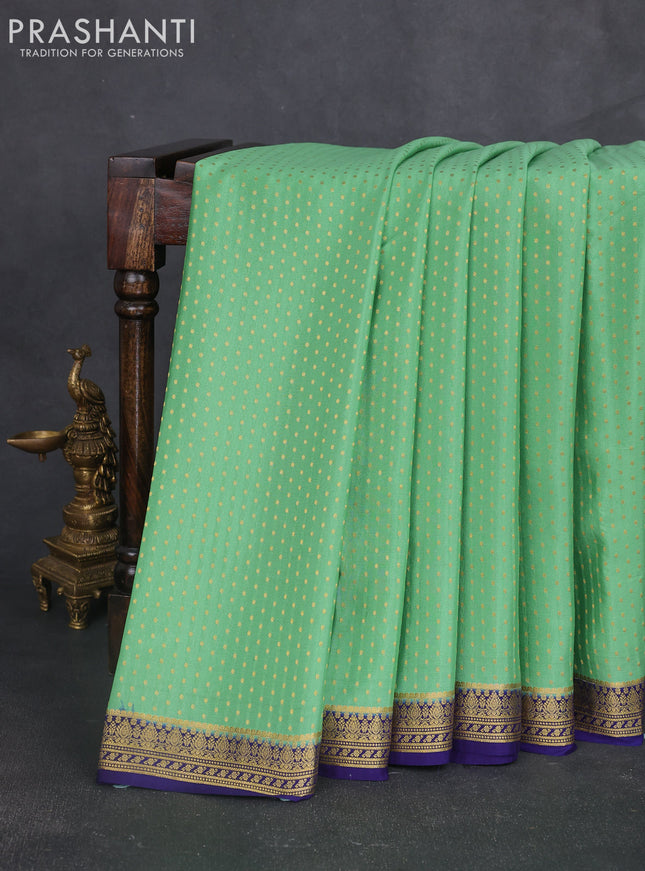 Pure mysore silk sareee pastel green and navy blue with allover zari woven buttas and zari woven border
