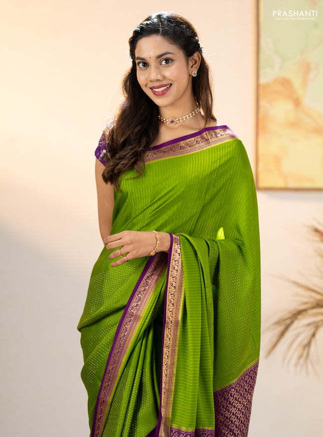 Pure mysore silk sareee mehendi green and purple with allover zari woven buttas and zari woven border