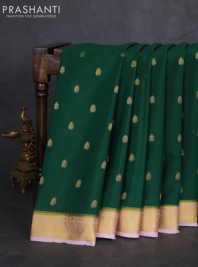 Pure mysore silk sareee dark green and mild peach pink with allover zari woven buttas and zari woven border