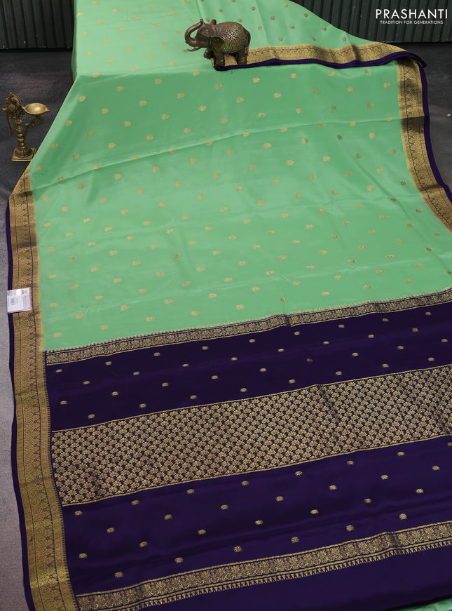 Pure mysore silk sareee pista green and violet with allover zari woven buttas and zari woven border
