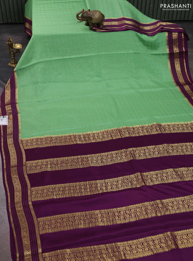 Pure mysore silk sareee pastel green and purple with allover zari woven geometric weaves and zari woven border