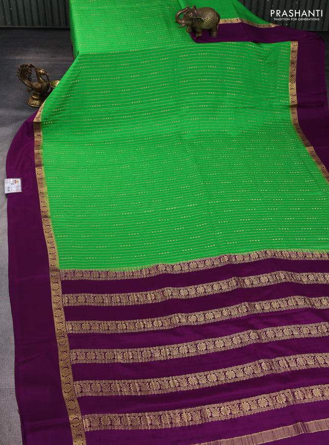 Pure mysore silk sareee green and purple with allover zari weaves and zari woven simple border