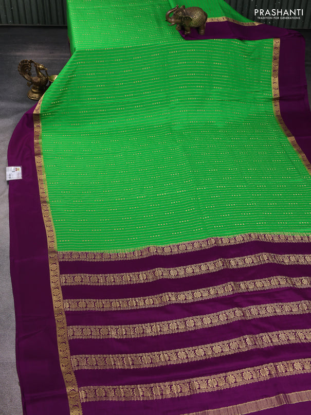 Pure mysore silk sareee green and purple with allover zari weaves and zari woven simple border