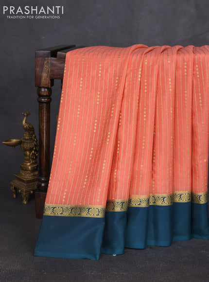 Pure mysore silk sareee peach orange and peacock green with allover zari weaves and zari woven simple border