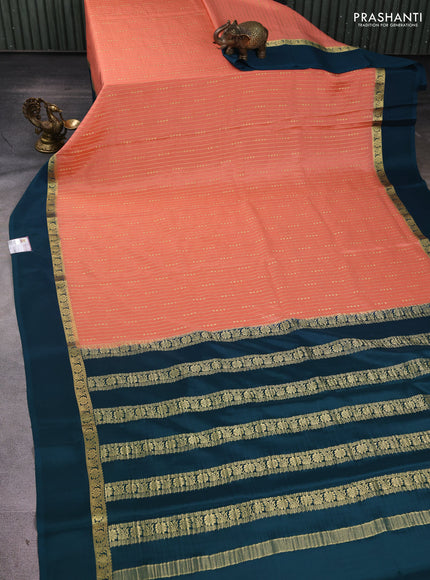 Pure mysore silk sareee peach orange and peacock green with allover zari weaves and zari woven simple border
