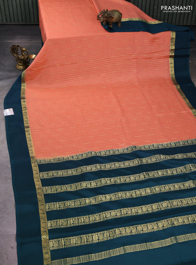 Pure mysore silk sareee peach orange and peacock green with allover zari weaves and zari woven simple border