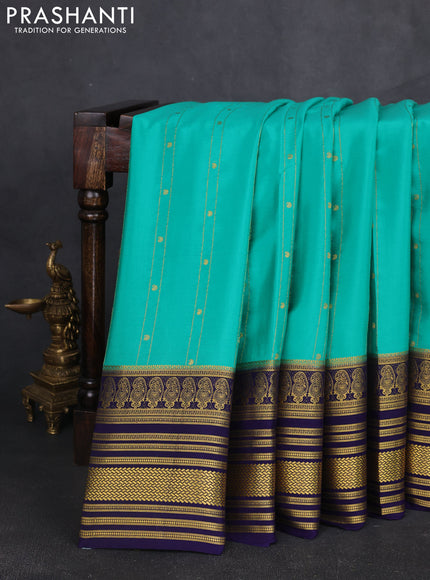 Pure mysore silk sareee teal green shade and blue with allover zari weaves and long zari woven border