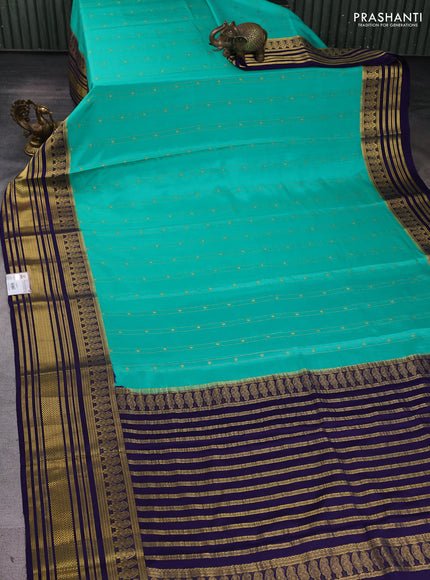 Pure mysore silk sareee teal green shade and blue with allover zari weaves and long zari woven border