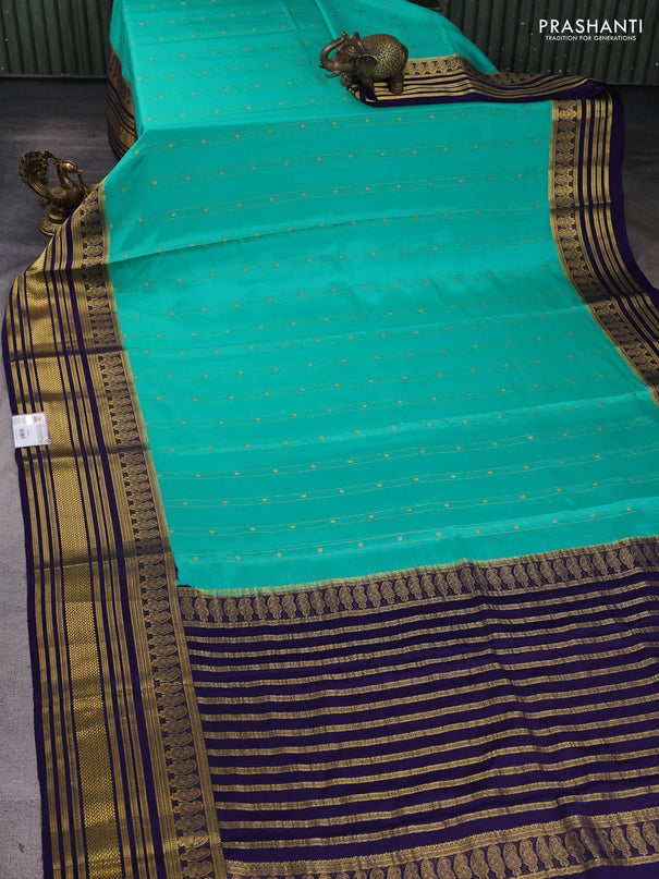 Pure mysore silk sareee teal green shade and blue with allover zari weaves and long zari woven border