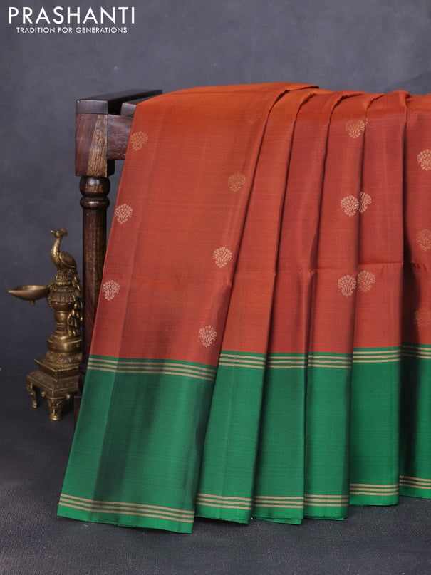 Pure soft silk saree rust shade and green with allover zari woven buttas and long rettapet zari woven border