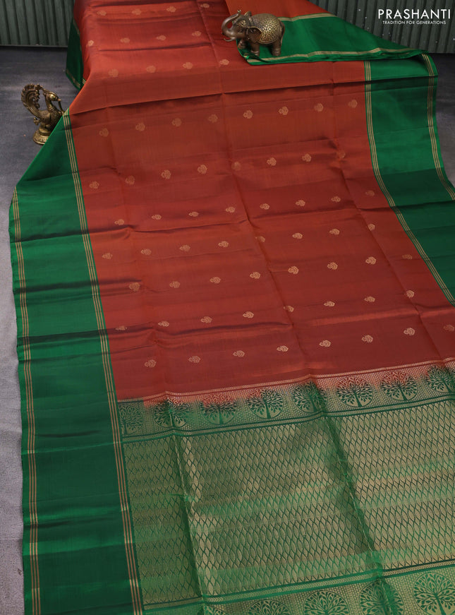 Pure soft silk saree rust shade and green with allover zari woven buttas and long rettapet zari woven border