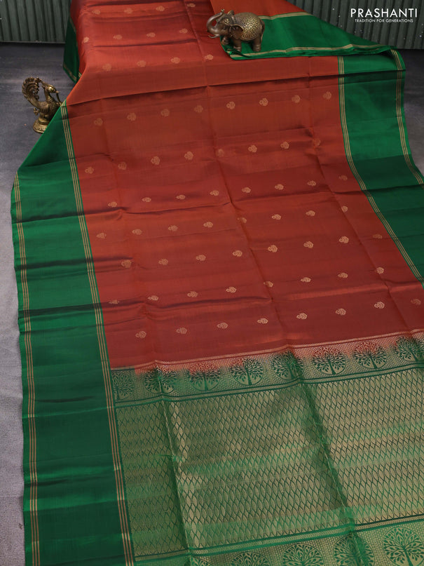 Pure soft silk saree rust shade and green with allover zari woven buttas and long rettapet zari woven border