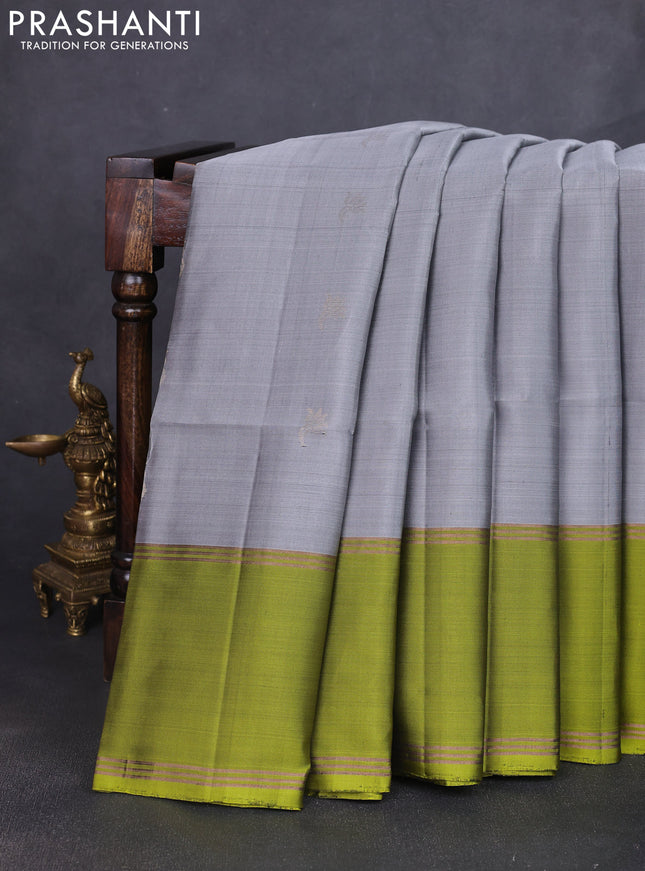 Pure soft silk saree grey and light green with allover zari woven buttas and rettapet zari woven border