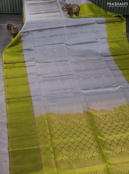 Pure soft silk saree grey and light green with allover zari woven buttas and rettapet zari woven border
