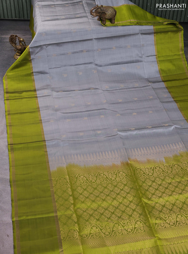 Pure soft silk saree grey and light green with allover zari woven buttas and rettapet zari woven border