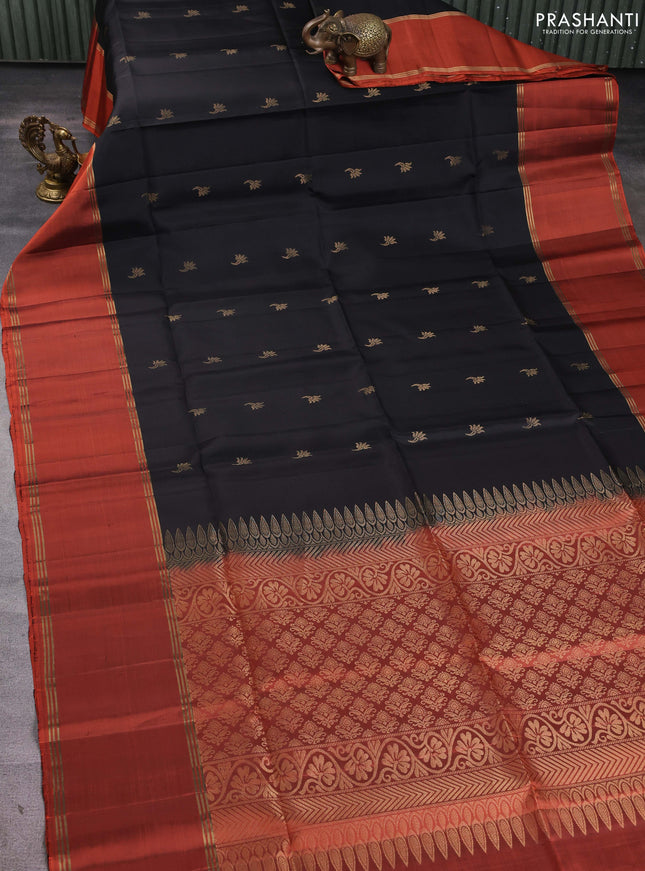 Pure soft silk saree black and rust shade with allover zari woven buttas and rettapet zari woven border