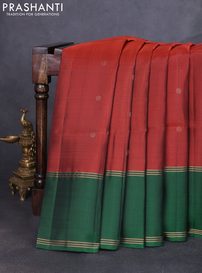 Pure soft silk saree rust shade and green with allover zari woven buttas and rettapet zari woven border