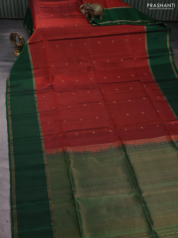 Pure soft silk saree rust shade and green with allover zari woven buttas and rettapet zari woven border