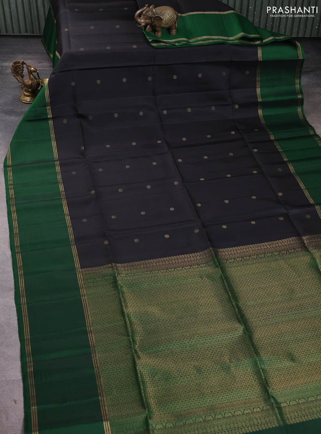 Pure soft silk saree black and green with allover zari woven buttas and rettapet zari woven border