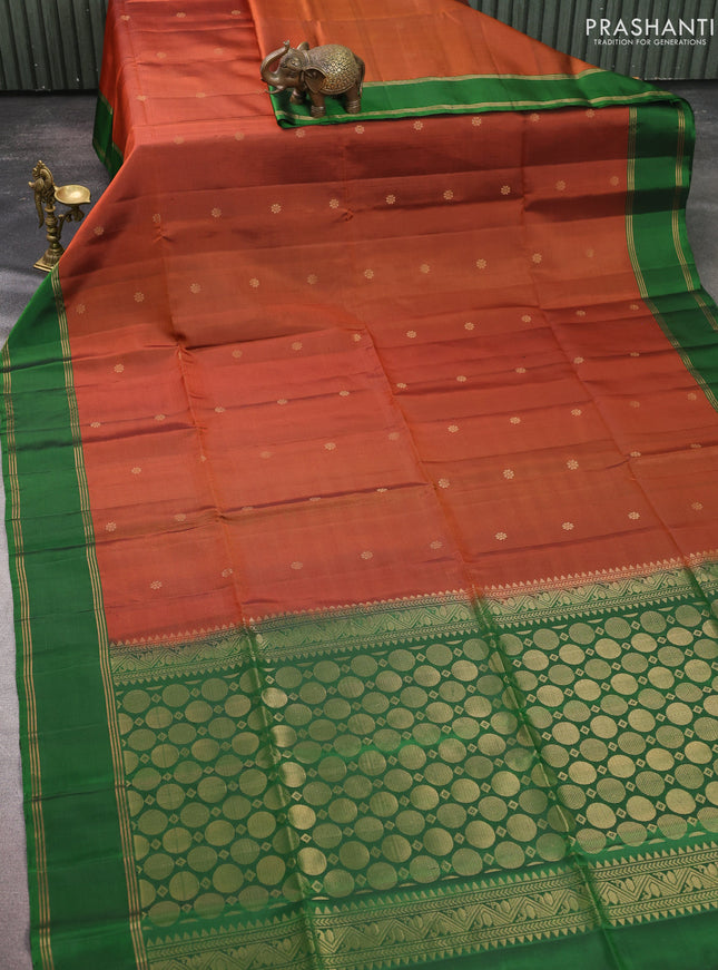 Pure soft silk saree rust shade and green with allover zari woven buttas and rettapet zari woven border