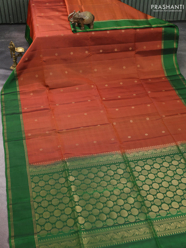 Pure soft silk saree rust shade and green with allover zari woven buttas and rettapet zari woven border