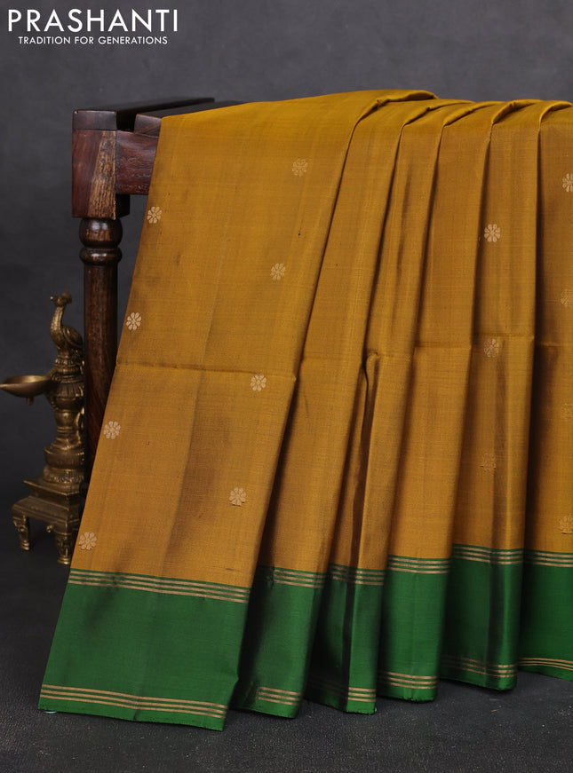 Pure soft silk saree dark mustard and green with allover zari woven buttas and rettapet zari woven border