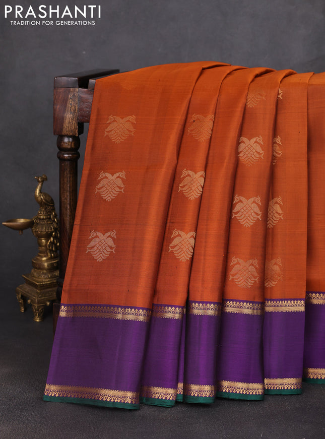 Pure soft silk saree rust shade and purple with allover zari woven buttas and rettapet zari woven border