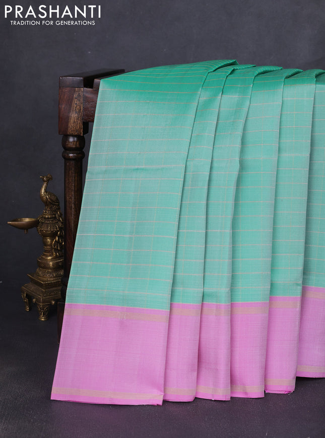 Pure soft silk saree teal green shade and lotus pink with allover zari checked pattern and rettapet zari woven border