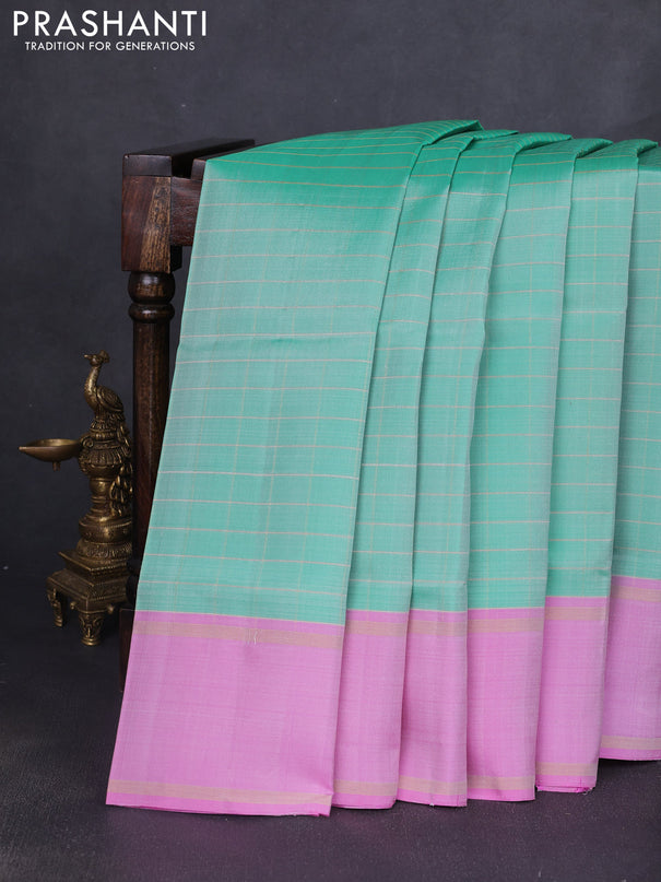 Pure soft silk saree teal green shade and lotus pink with allover zari checked pattern and rettapet zari woven border