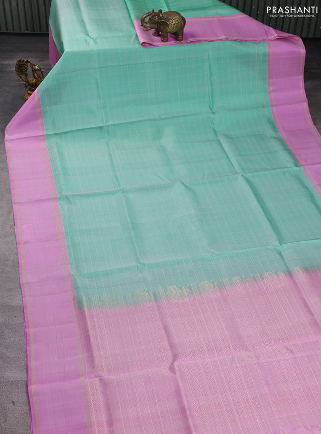 Pure soft silk saree teal green shade and lotus pink with allover zari checked pattern and rettapet zari woven border