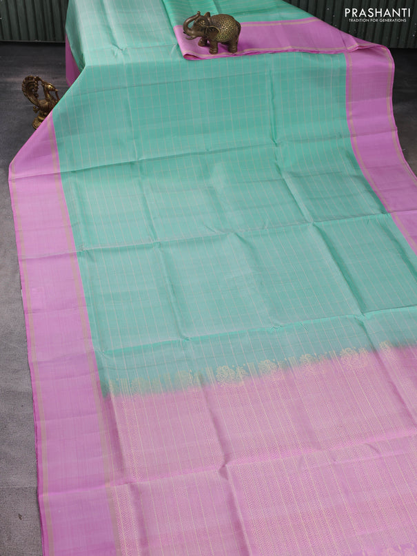 Pure soft silk saree teal green shade and lotus pink with allover zari checked pattern and rettapet zari woven border