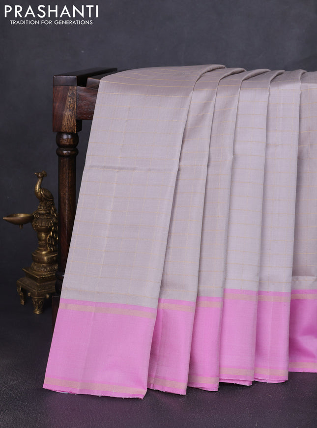 Pure soft silk saree grey and lotus pink with allover zari checked pattern and rettapet zari woven border