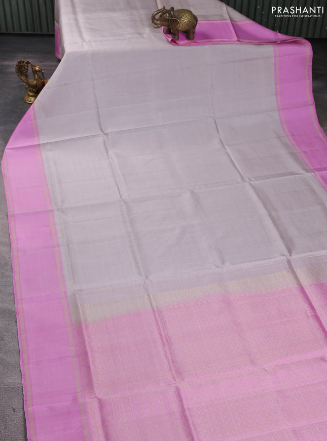Pure soft silk saree grey and lotus pink with allover zari checked pattern and rettapet zari woven border