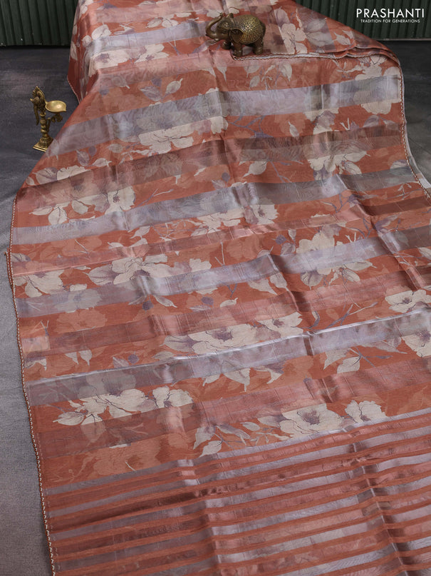 Organza tissue tussar saree rust shade with floral prints and lace work border