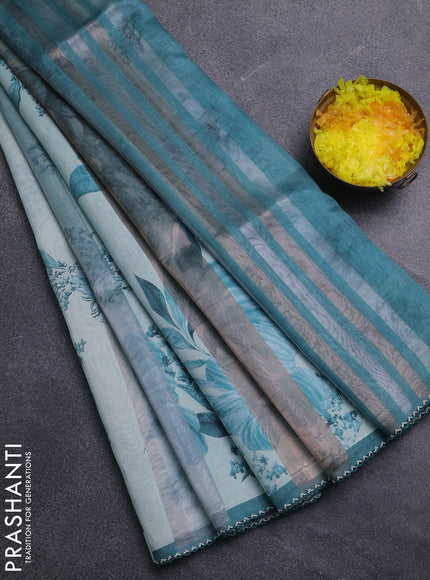 Organza tissue tussar saree teal shade with floral prints and lace work border