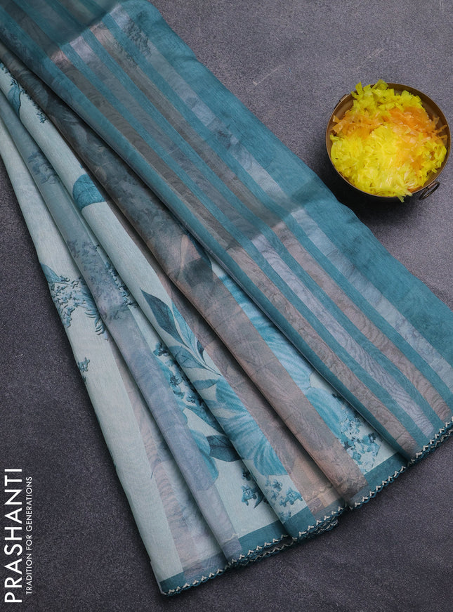 Organza tissue tussar saree teal shade with floral prints and lace work border