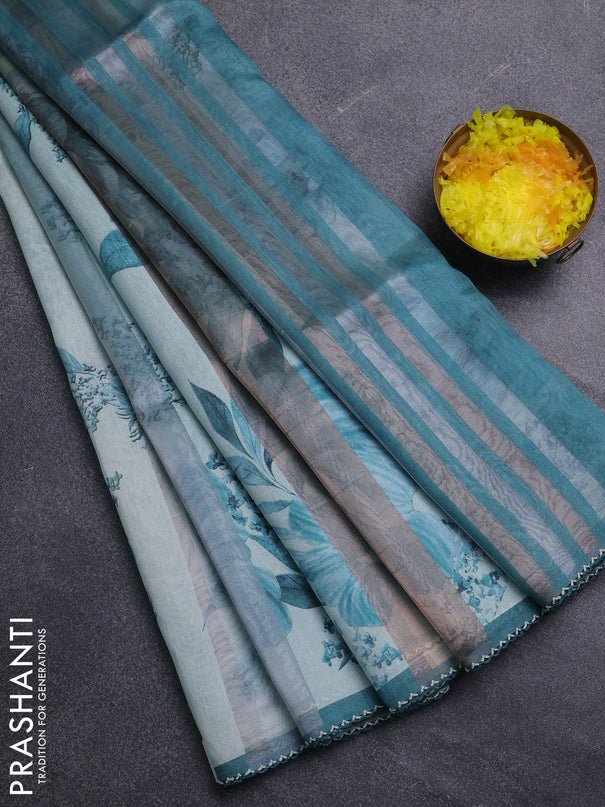Organza tissue tussar saree teal shade with floral prints and lace work border
