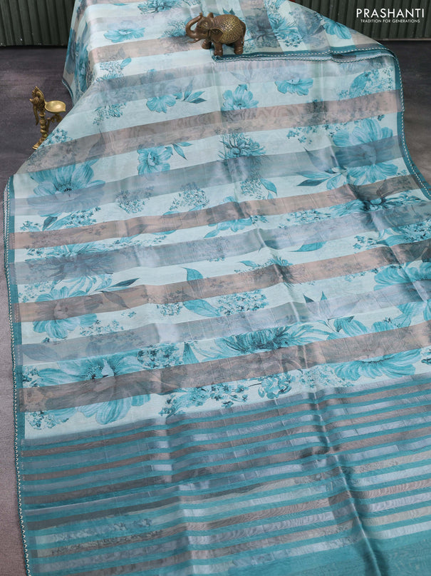Organza tissue tussar saree teal shade with floral prints and lace work border