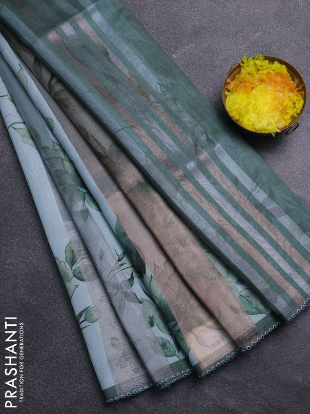 Organza tissue tussar saree teal shade with floral prints and lace work border