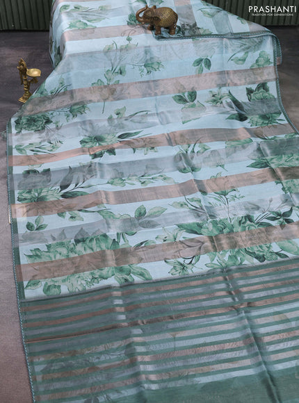 Organza tissue tussar saree teal shade with floral prints and lace work border