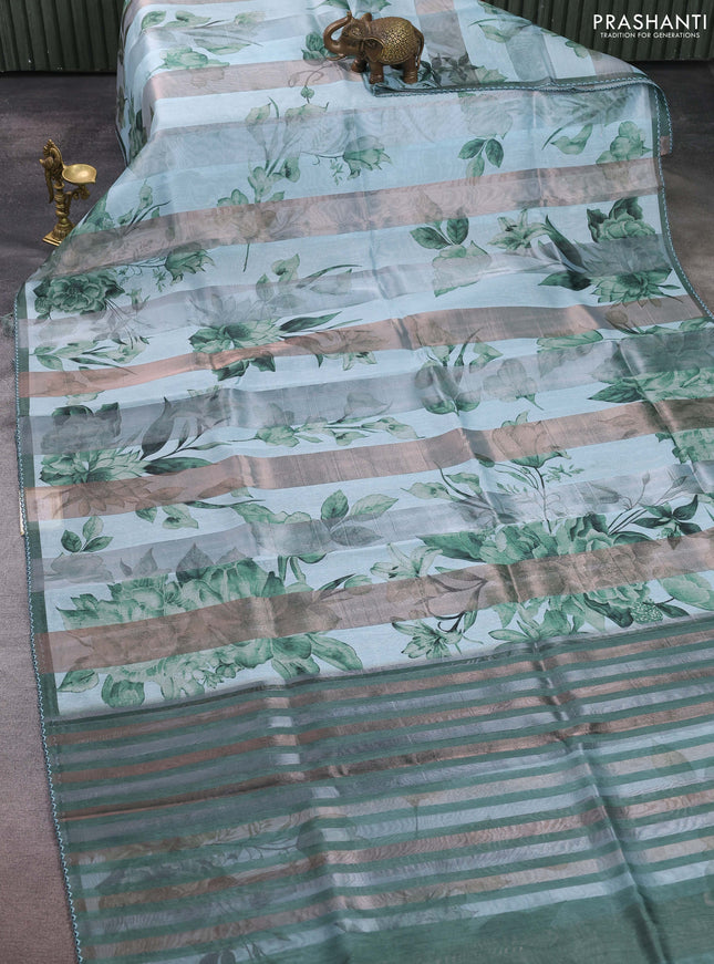 Organza tissue tussar saree teal shade with floral prints and lace work border