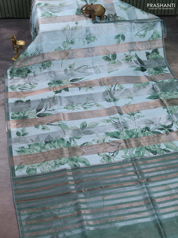 Organza tissue tussar saree teal shade with floral prints and lace work border