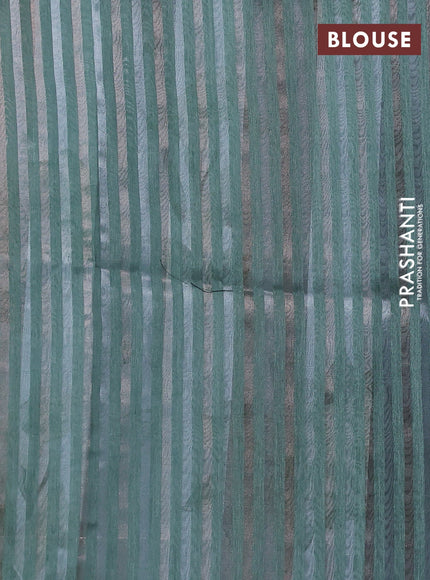 Organza tissue tussar saree teal shade with floral prints and lace work border