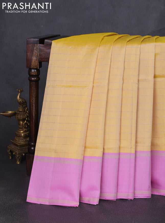 Pure soft silk saree yellow and lotus pink with allover zari woven checked pattern and rettapet zari woven border