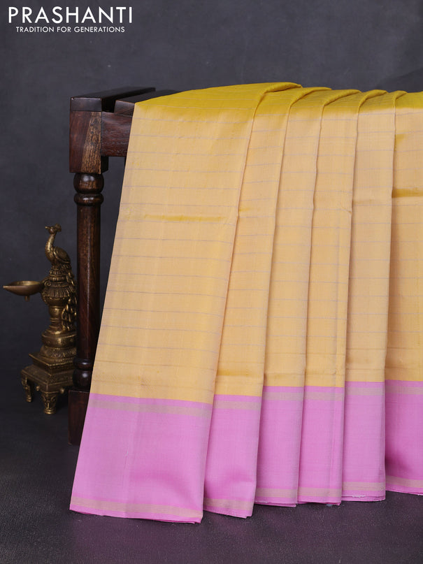 Pure soft silk saree yellow and lotus pink with allover zari woven checked pattern and rettapet zari woven border
