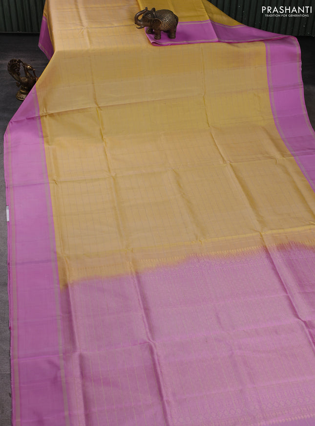 Pure soft silk saree yellow and lotus pink with allover zari woven checked pattern and rettapet zari woven border