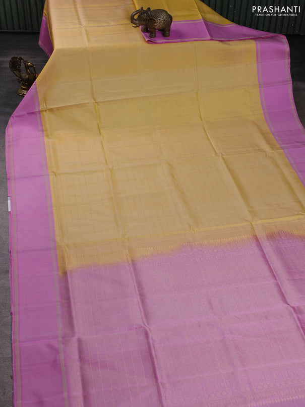 Pure soft silk saree yellow and lotus pink with allover zari woven checked pattern and rettapet zari woven border